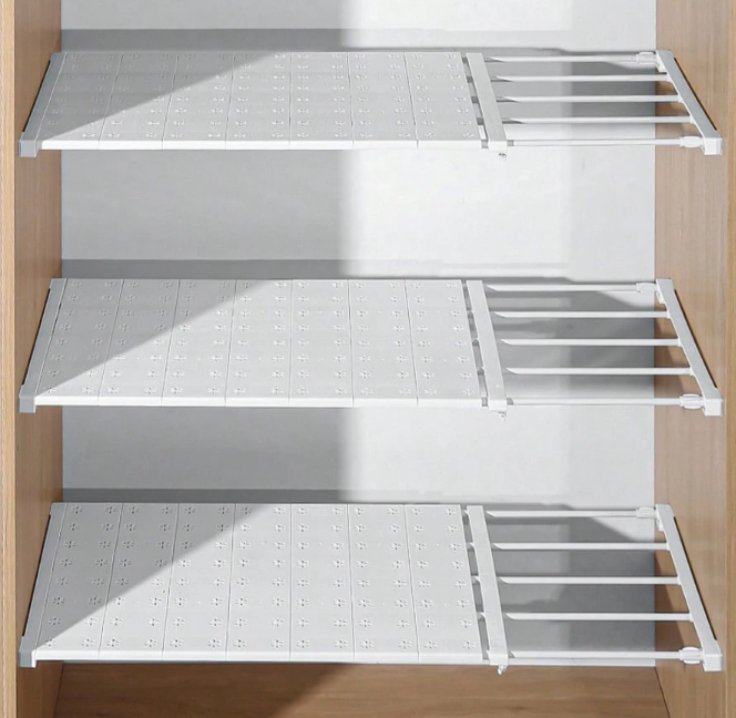Adjustable tension shelf divider